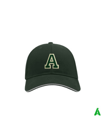 Personalised forest green hat with a green embroidered letter ‘A’ sewn onto a beige felt base