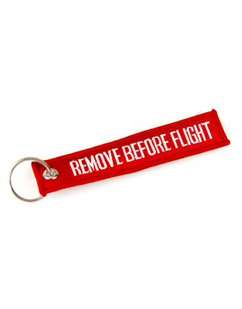 Llaveros Remove Before Flight color rojo.