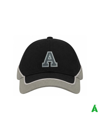 A two-tone black and grey hat, originally customised with the letter ‘A’ embroidered and sewn onto a patch